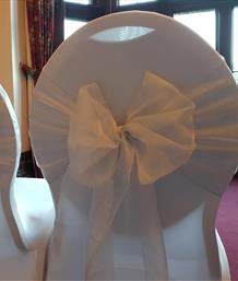 White Wedding Chair Cover and Silver Sash Hire including delivery, setup and collection at Beaumanor Hall in Woodhouse Eaves, Leicestershire by the Party Save Smile events team.